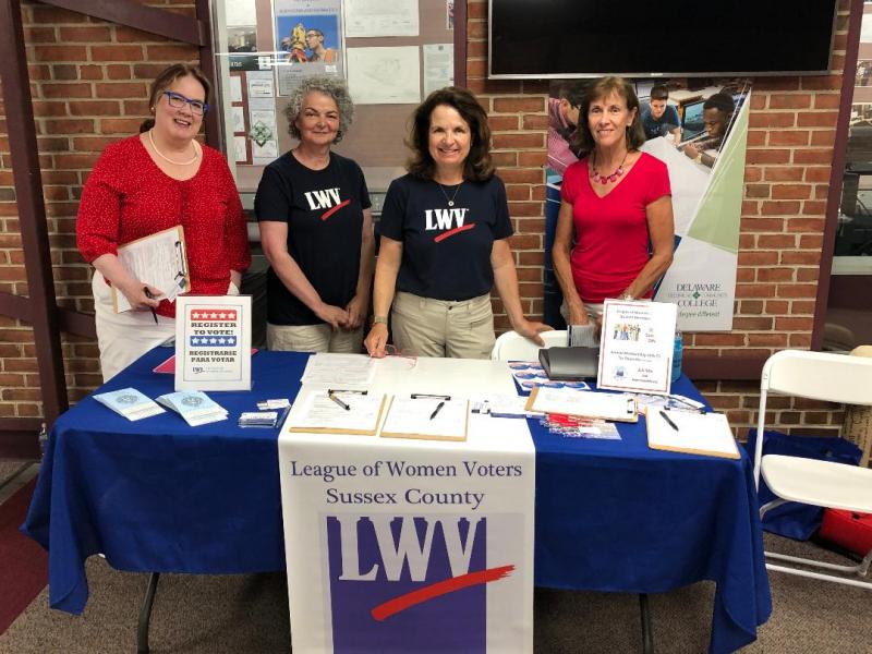 LWVSC volunteers (l-r) Charlotte Frye, Marylinda Maddi, Martha Redmond and Debbie Zwicke set up the table for National Voter Registration Day, Sept. 25, at Del Tech. SUBMITTED PHOTO